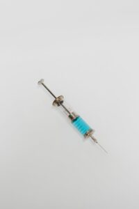 syringe with blue liquid